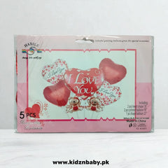 Close-up of heart-shaped and engagement ring foil balloons spelling "I Love You"