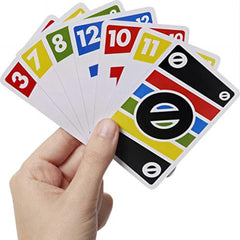 Hand holding a set of colorful card games with numbers and symbols