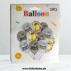 Close-up of gold and white Umrah Mubarak confetti balloons for Islamic celebration