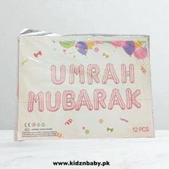 Close-up of sleek black and gold Umrah Mubarak banner foil balloons for photo backdrop