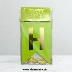 Green birthday card with gold letter 'H' and bow, packaging on a white background