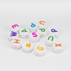 White letter beads with colorful letters on a white background