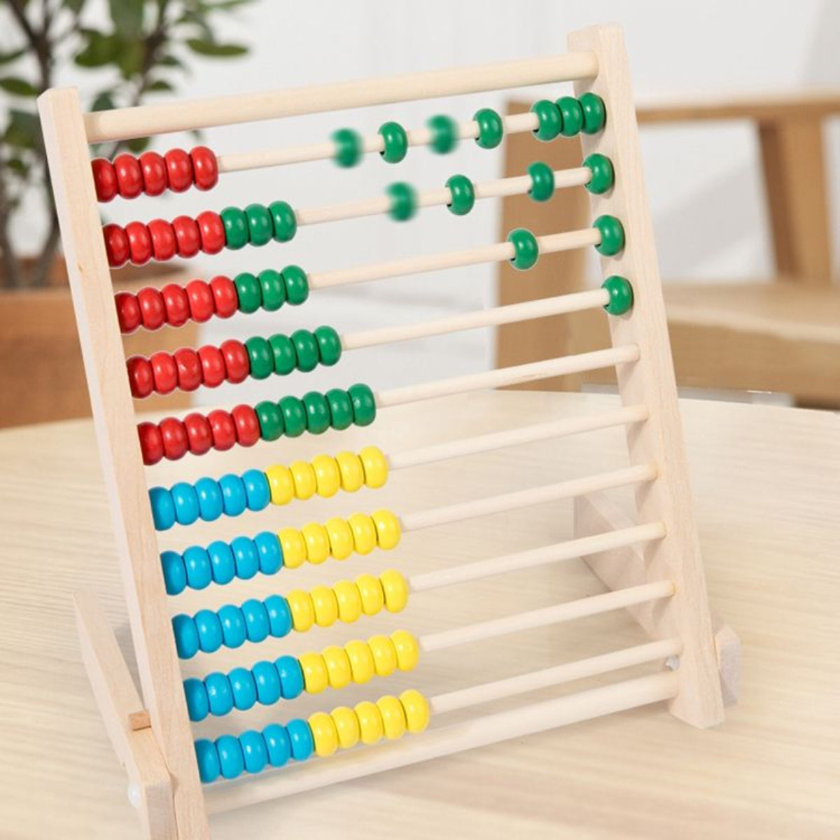 Colorful abacus on a wooden surface with a blurred background