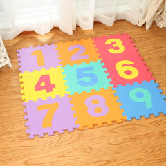 Colorful number mats on a wooden floor with white curtains in the background
