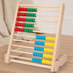 Wooden abacus with colorful beads on a wooden surface